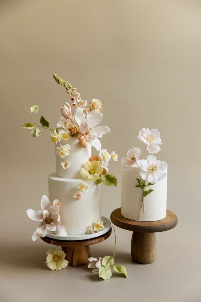 Two small wedding cakes with flowers
